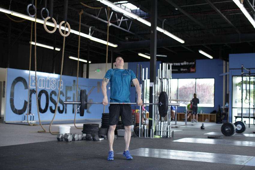 Dumbbell Clean and Press start and end position