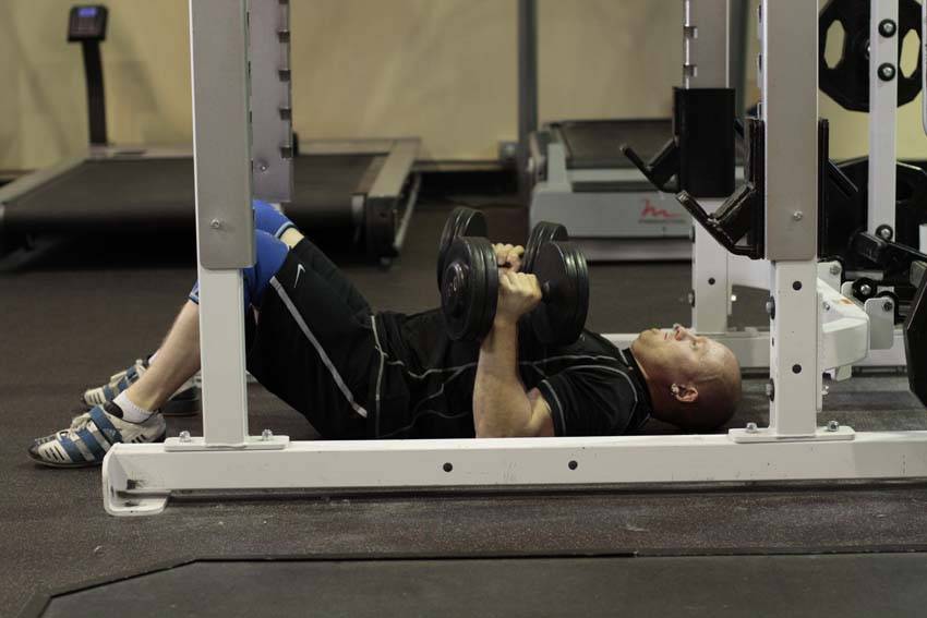 Dumbbell Floor Press start and end position