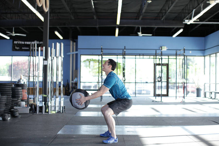 Medicine Ball Scoop Throw start and end position