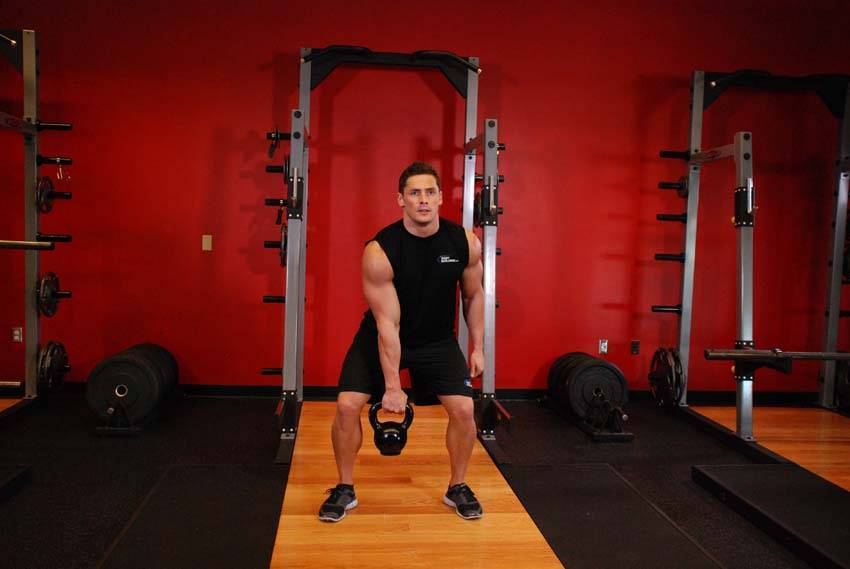One-Arm Kettlebell Clean and Jerk start and end position