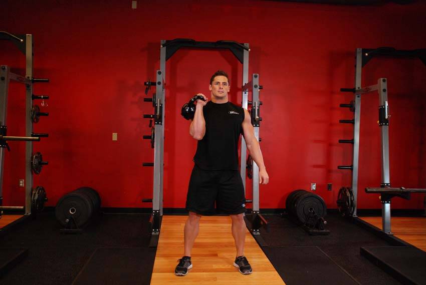One-Arm Kettlebell Clean and Jerk start and end position