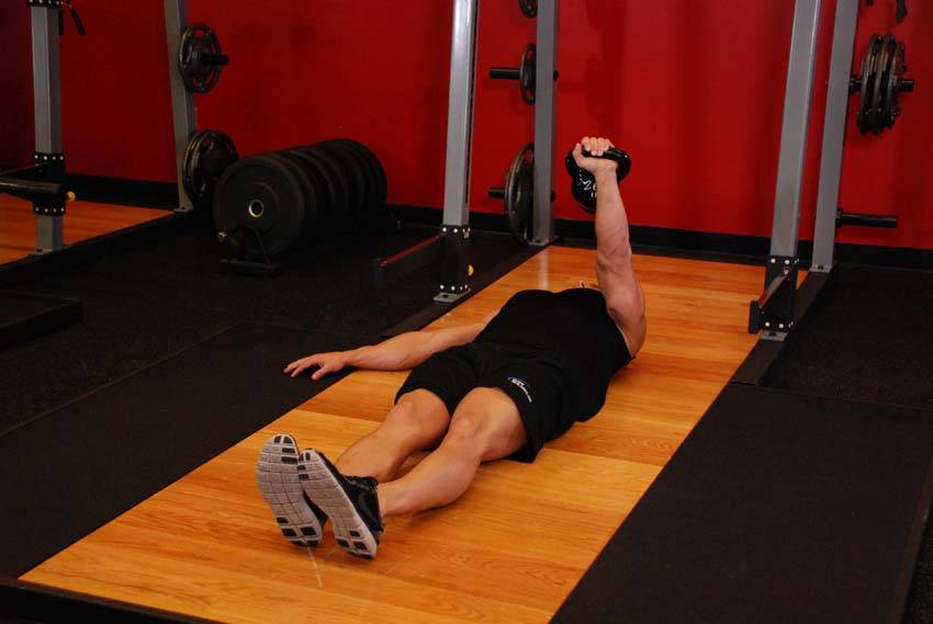 One-Arm Kettlebell Floor Press start and end position