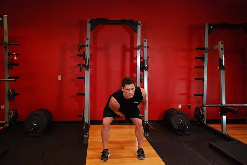 One-Arm Kettlebell Snatch start and end position