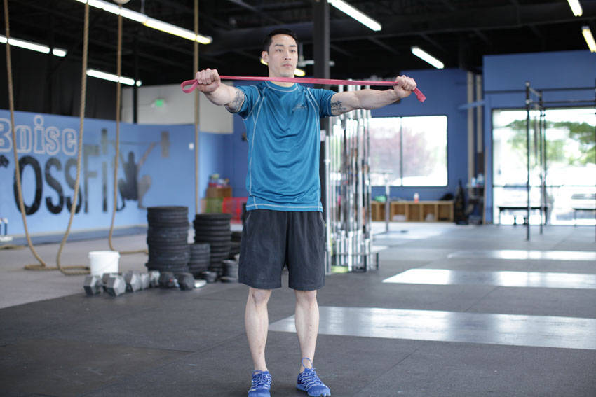 Resistance Band Pull-Apart start and end position