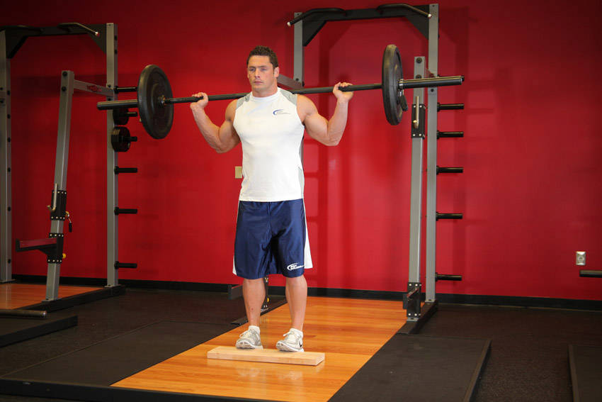 Standing Barbell Calf Raise start and end position
