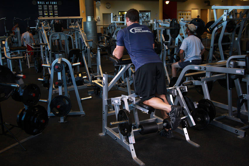 Standing Machine Leg Curl start and end position