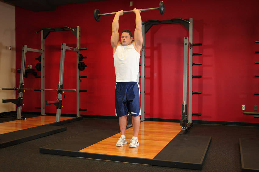 Standing Overhead Barbell Triceps Extension start and end position