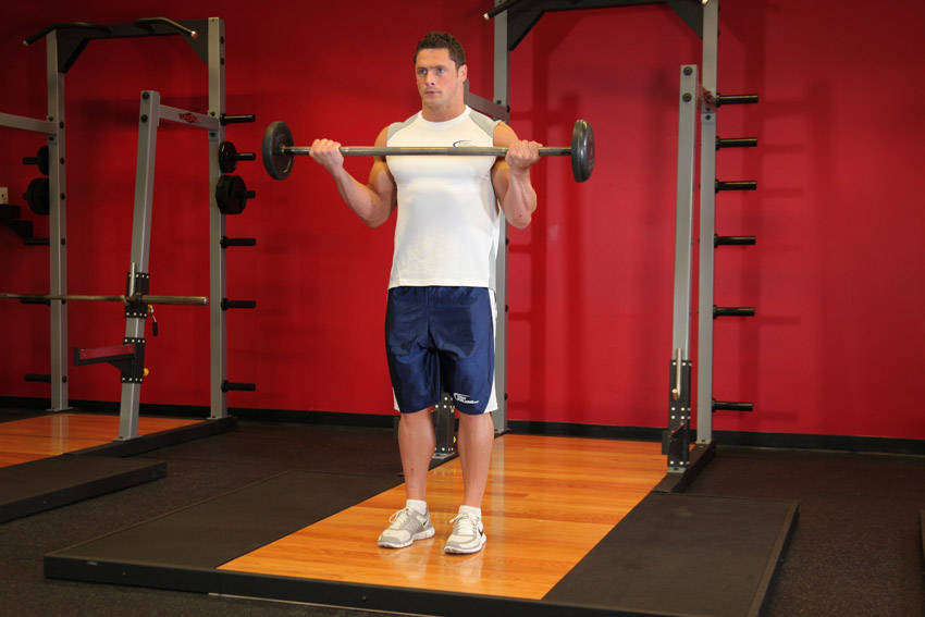 Wide-Grip Standing Barbell Curl start and end position